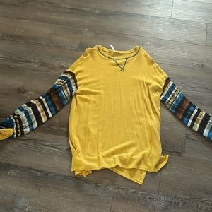 Super cute, light weight gold sweater with multi colored sleeves